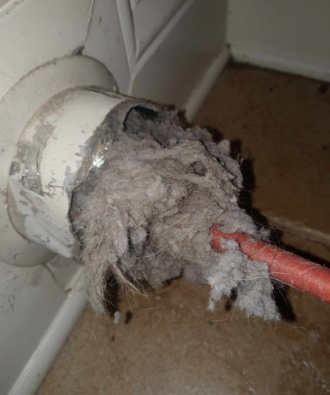 Rotary brush cleaning inside dryer vent